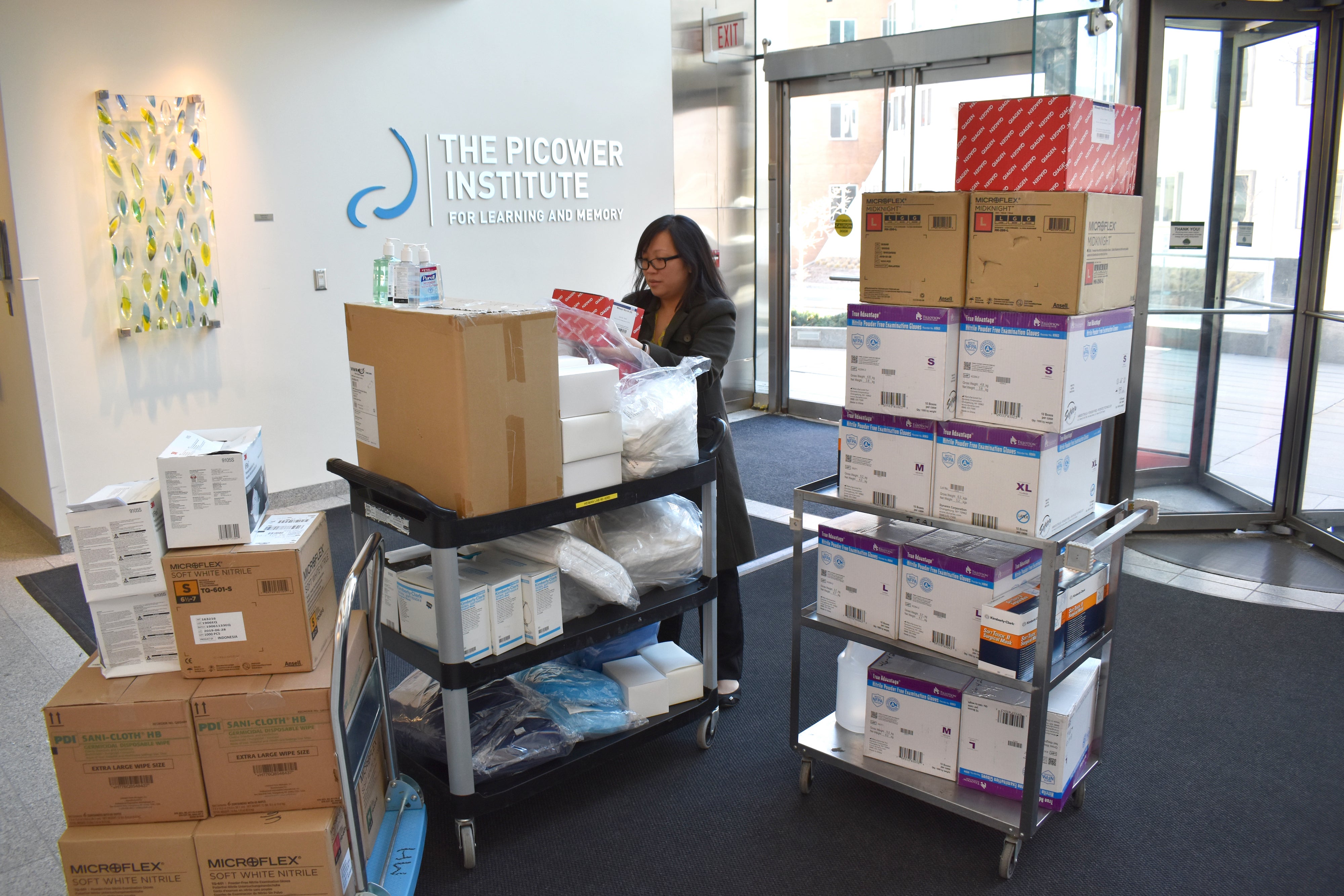 Chan in her building at MIT collecting supplies to donate to MGH during March 2020 of the pandemic when supplies were low.