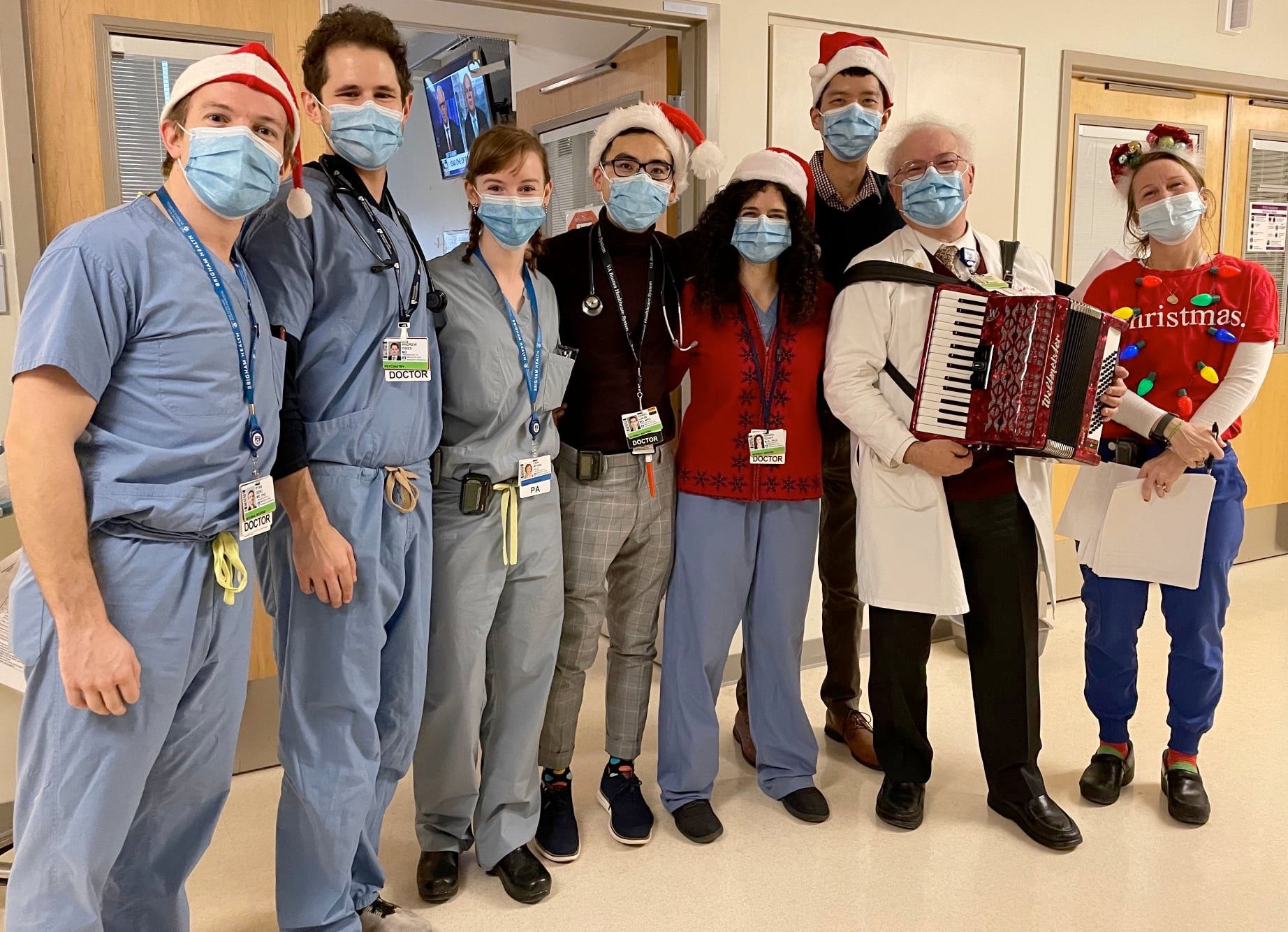 Thomas Michel with Rosie his accordion and a group of interns and residents at the “Cardiotonics” Christmas gig at Brigham and Women’s Hospital.