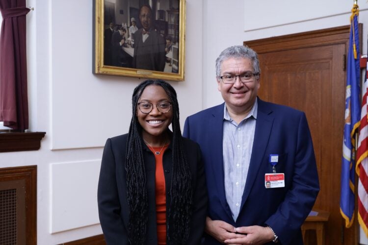 Anesu Karen Murambadoro with mentor Edward Rodriguez at closing ceremony.